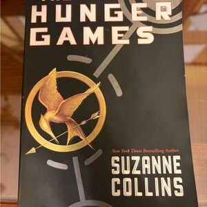 The Hunger Games by Suzanne Collins soft cover book